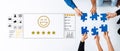 Team Collaboration for Customer Feedback with Puzzle Pieces and Satisfaction Rating in Office Setting, Emphasizing Royalty Free Stock Photo
