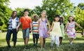 Group of diverse kids having fun together in the park Royalty Free Stock Photo