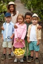 Group of diverse kindergarten kids friends in garden, greenhouse Royalty Free Stock Photo