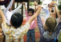 Group of diverse kindergarten students hands up together Royalty Free Stock Photo