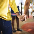 Group of diverse kindergarten students standing holding hands to Royalty Free Stock Photo