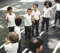 Group of diverse kindergarten students standing in line at playground Royalty Free Stock Photo