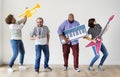 Group of diverse people enjoying music instruments Royalty Free Stock Photo