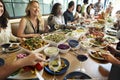 Group of diverse people are having lunch together Royalty Free Stock Photo