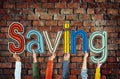 Group of Diverse People Holding the Word Saving Royalty Free Stock Photo