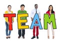 Group of Diverse People Holding Word Team Royalty Free Stock Photo