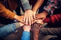 Group of diverse people putting their hands together on top of each other, A group of diverse hands holding each other in support Royalty Free Stock Photo