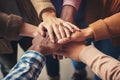 Group of diverse people putting their hands together on top of each other, Team members putting hands together close-up, top view Royalty Free Stock Photo