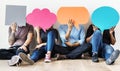 Group of diverse people with speech bubbles icons Royalty Free Stock Photo