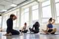 Group of diverse poople practicing yoga