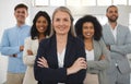 Group of diverse and powerful businesspeople standing together with their arms crossed in an office. Confident and Royalty Free Stock Photo