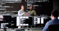 Group of diverse software engineers coding on computers