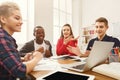 Group of diverse students studying at wooden table Royalty Free Stock Photo