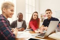 Group of diverse students studying at wooden table Royalty Free Stock Photo