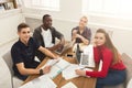 Group of diverse students studying at wooden table Royalty Free Stock Photo