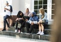 A group of diverse teenagers having conversation