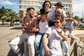 Group of diverse young people having fun together outdoor. Multiracial happy millennial friends. Unity and friendship concept Royalty Free Stock Photo