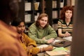 Group of Diverse Young People Listening Attentively during Study Session Royalty Free Stock Photo