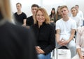 Group of diverse young people sitting in a conference room Royalty Free Stock Photo