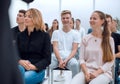 Group of diverse young people sitting in a conference room Royalty Free Stock Photo