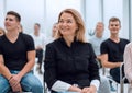 Group of diverse young people sitting in a conference room Royalty Free Stock Photo