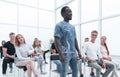 Group of diverse young people sitting in a conference room Royalty Free Stock Photo