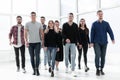 Group of diverse young people walking in a new office Royalty Free Stock Photo