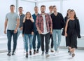 group of diverse young people walking in a new office Royalty Free Stock Photo