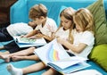 Group of Diverse Young Students Reading Children Story Book Together Royalty Free Stock Photo