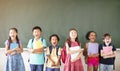 Diverse young students standing together in classroom Royalty Free Stock Photo