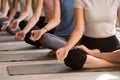 Group of women practicing yoga in Easy Seat, close up