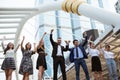 Group of diversity business people hands up for teamwork and successful