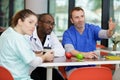 group doctors in cafeteria or canteen relaxing Royalty Free Stock Photo