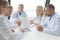 Group of doctors discuss x-ray Royalty Free Stock Photo