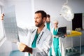 Group of doctors examining an x-ray in hospital to make diagnosis Royalty Free Stock Photo