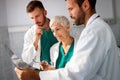 Group of doctors examining an x-ray in hospital to make diagnosis Royalty Free Stock Photo