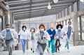 Group of doctors with face masks running, corona virus concept.