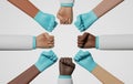 Group doctors holding fists together on white background