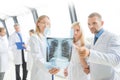 Group of doctors discuss x-ray Royalty Free Stock Photo