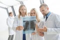 Group of doctors discuss x-ray Royalty Free Stock Photo