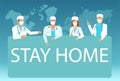 Group of doctors medical staff wearing surgical masks and holding message board asking people to stay home Royalty Free Stock Photo