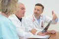 Group doctors meeting and taking notes at medical office Royalty Free Stock Photo