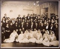 Group of doctors and nurses posing in a big hall, archive photo