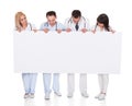 Group of doctors with placard Royalty Free Stock Photo