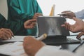 Group of doctors reading a document in meeting room at hospital Royalty Free Stock Photo