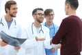 Group of doctors showing the patient his x-ray Royalty Free Stock Photo