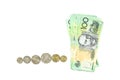 Group of 100 dollar Australian notes and many coins aud on white background Royalty Free Stock Photo