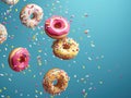 a group of donuts with sprinkles falling