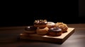 a group of donuts on a wooden board