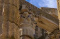 Group of doves perched on the ornate moldings of the marble columns and Corinthian-style capital of the well-preserved Roman Royalty Free Stock Photo